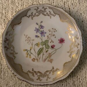 Vintage 1960’s plate with flowers and gold trim.